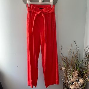 A coral reddish Banana Republic pair of linen dress pants with zipper and tie